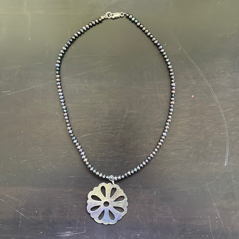 Handmade carved shell necklace